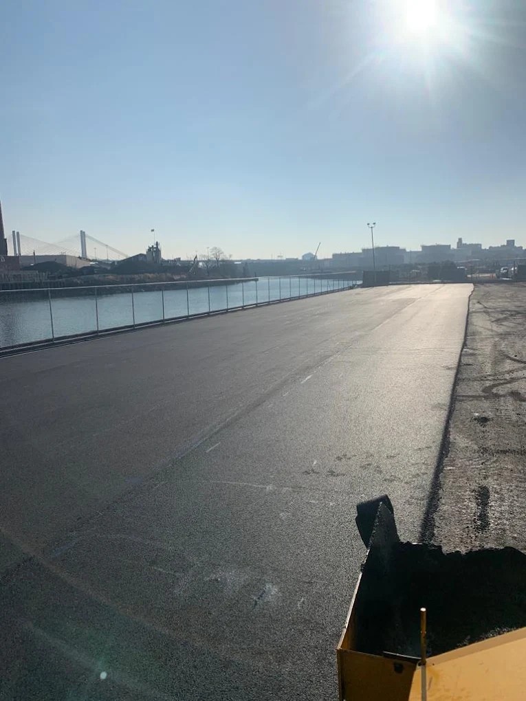 Paving contractor in College Point NY — commercial asphalt installation at a Queens parking lot